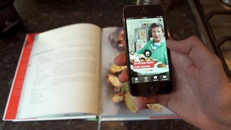 Jamie Oliver adopts augmented reality to enhance traditional cookbook. 