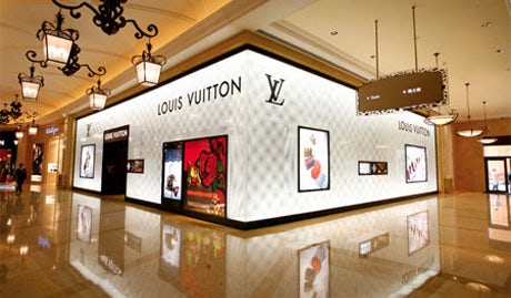 Louis Vuitton owner presses on with plans to upscale brands despite sales  slowdown