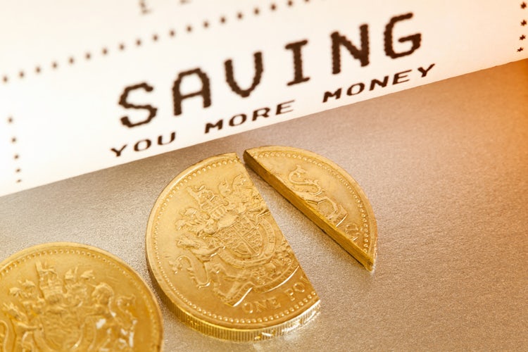 "Saving you more money. Whether by discounting a percentage of the cost, or handing back a cashback, the concept of Saving you money is illustrated with a checkout till receipt and a cut one pound sterling coin."