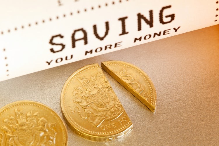"Saving you more money. Whether by discounting a percentage of the cost, or handing back a cashback, the concept of Saving you money is illustrated with a checkout till receipt and a cut one pound sterling coin."