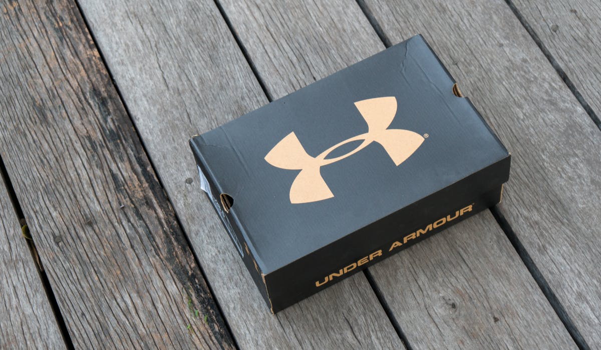 Under Armour shifts strategy to in and brand
