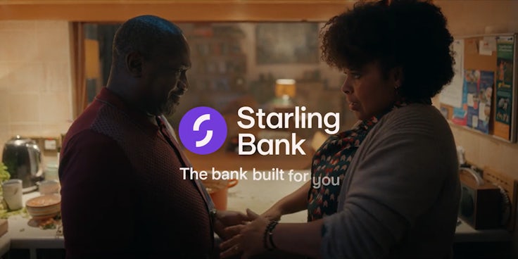 A screenshot from a TV ad from Starling Bank's new brand platform, featuring two people dancing together in a kitchen