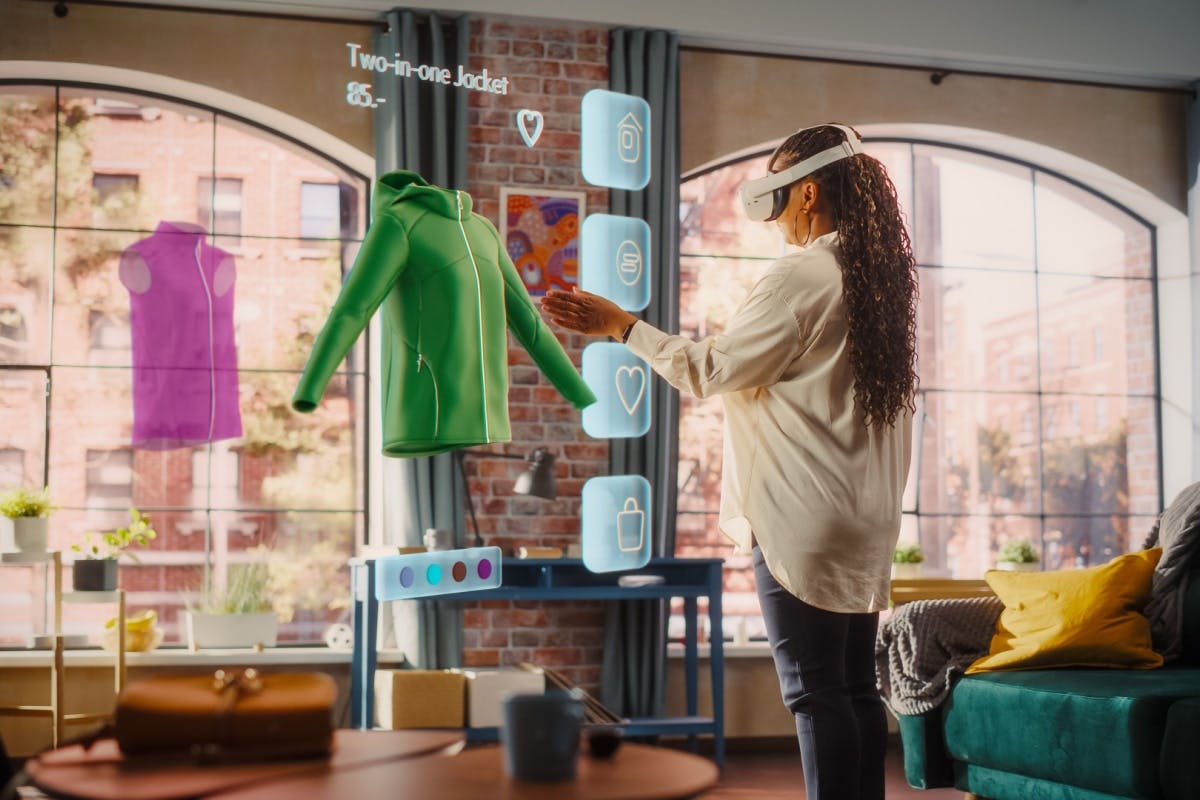 Woman with headset selecting VR clothes